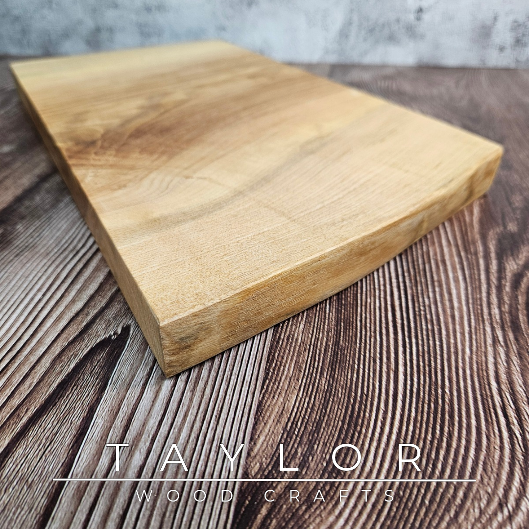 Handmade live edge hardwood cutting block crafted in Northern Ireland by Taylor Wood Crafts.
