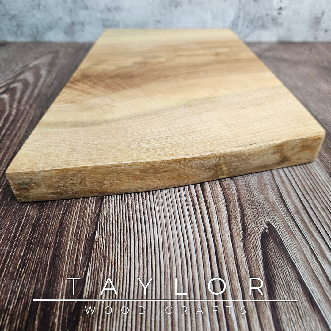 Handmade live edge hardwood cutting block crafted in Northern Ireland by Taylor Wood Crafts.