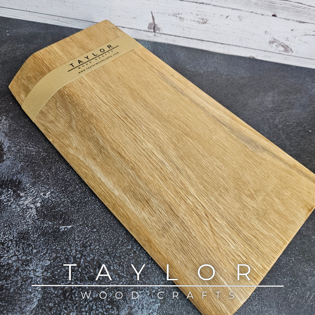 Handmade live edge Oak chopping block with natural timber grain and character, designed as a beautiful and practical addition to the family kitchen.