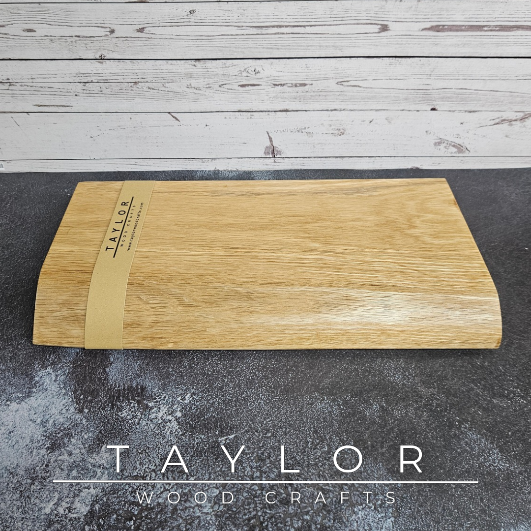Handmade live edge Oak chopping block with natural timber grain and character, designed as a beautiful and practical addition to the family kitchen.