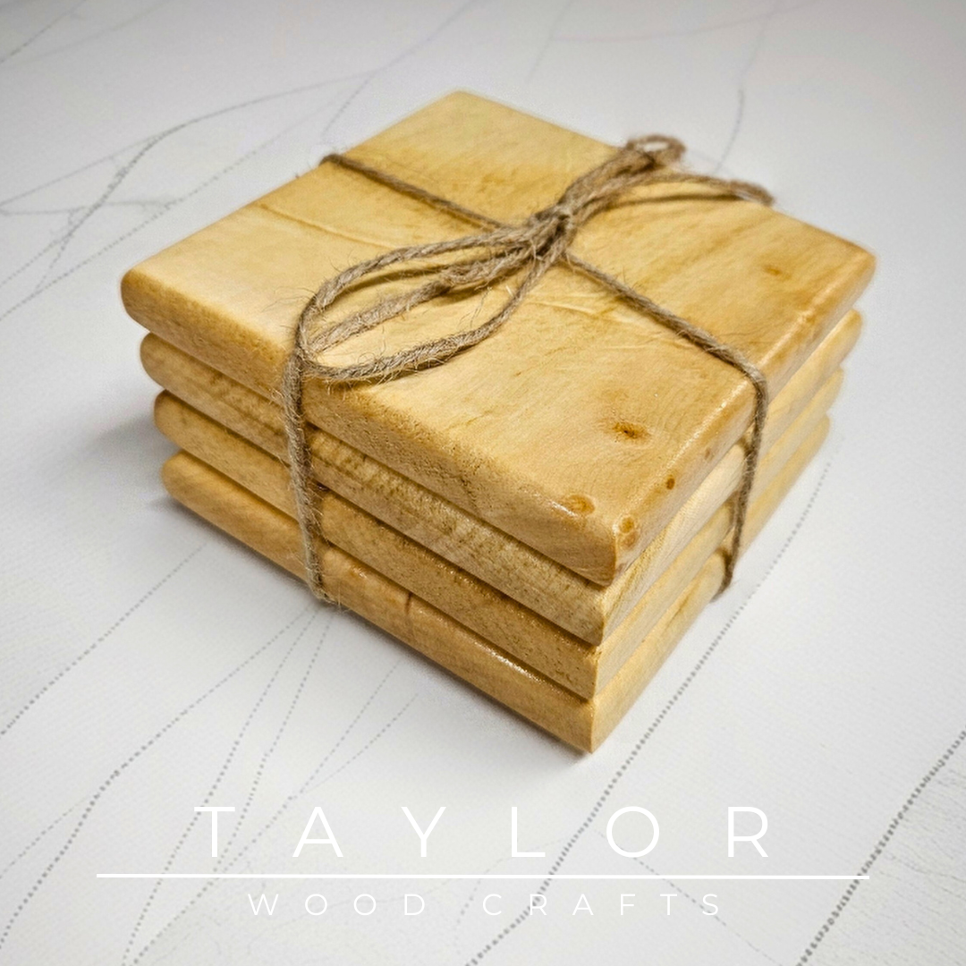Stack of wooden coasters tied with twine on a light surface, with 'Taylor Wood Crafts' branding.