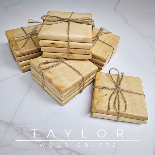 Wooden coasters tied with twine on a marble surface with 'Taylor Wood Crafts' branding.