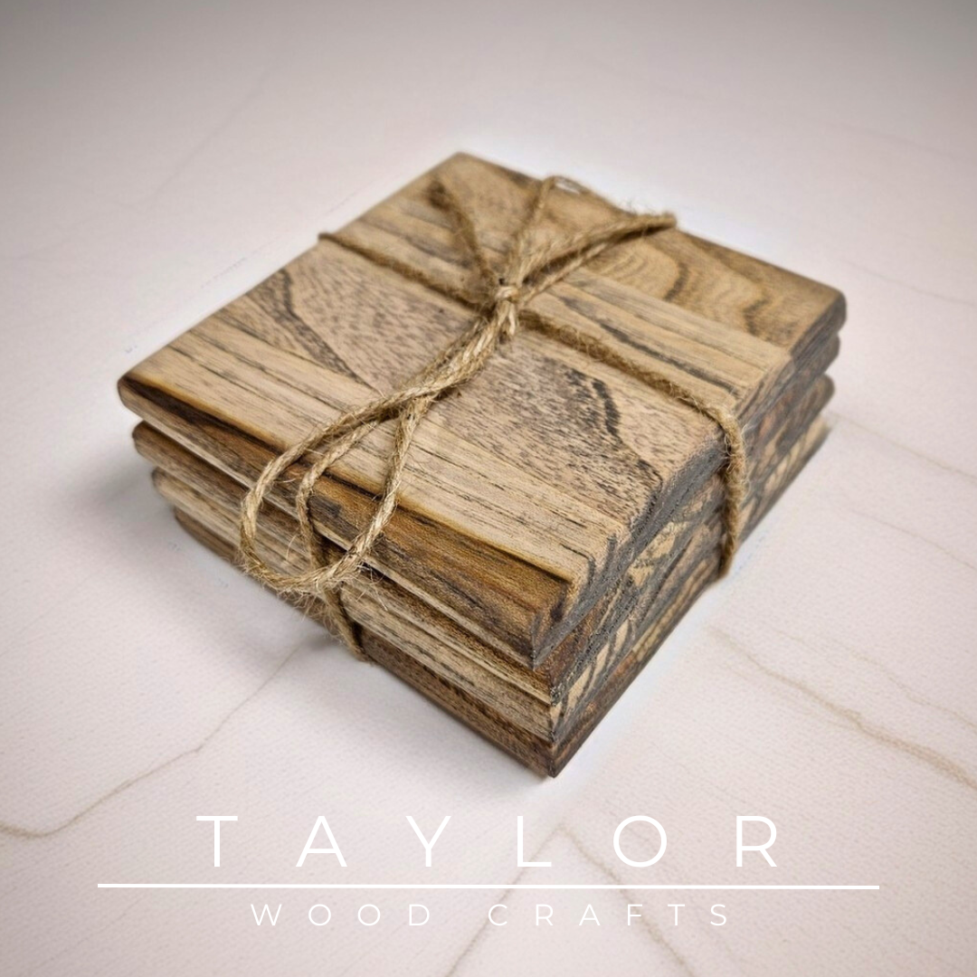 Stack of wooden coasters tied with twine on a light surface, with 'Taylor Wood Crafts' branding.