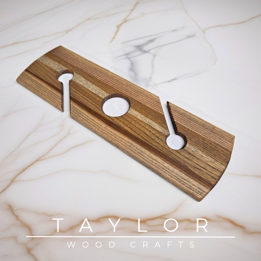 Wooden cutting board with decorative item on a marble surface, featuring 'Taylor Wood Crafts' branding.