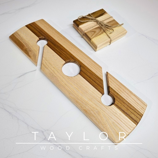Wooden cutting board with two white handles on a light gray background, featuring the 'Taylor Wood Crafts' brand.