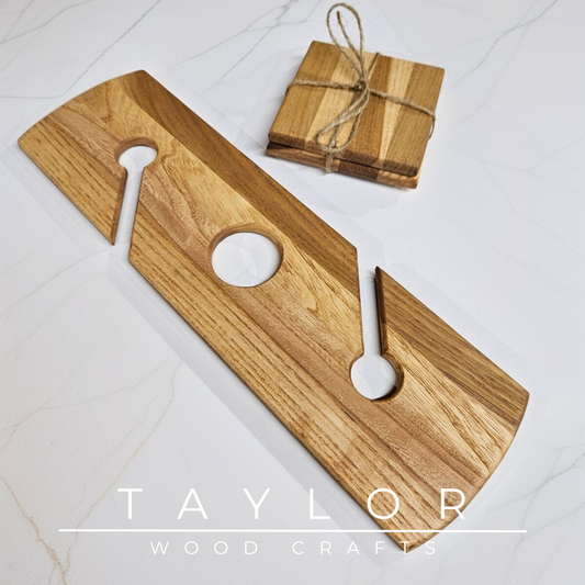 Wooden cutting board with two white handles and a stack of wooden coasters on a light background, branded 'Taylor Wood Crafts'.