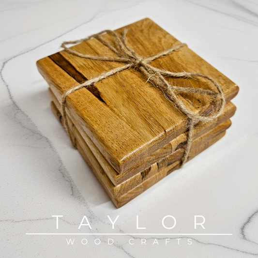 Stack of wooden coasters tied with twine on a marble surface, with 'Taylor Wood Crafts' branding.