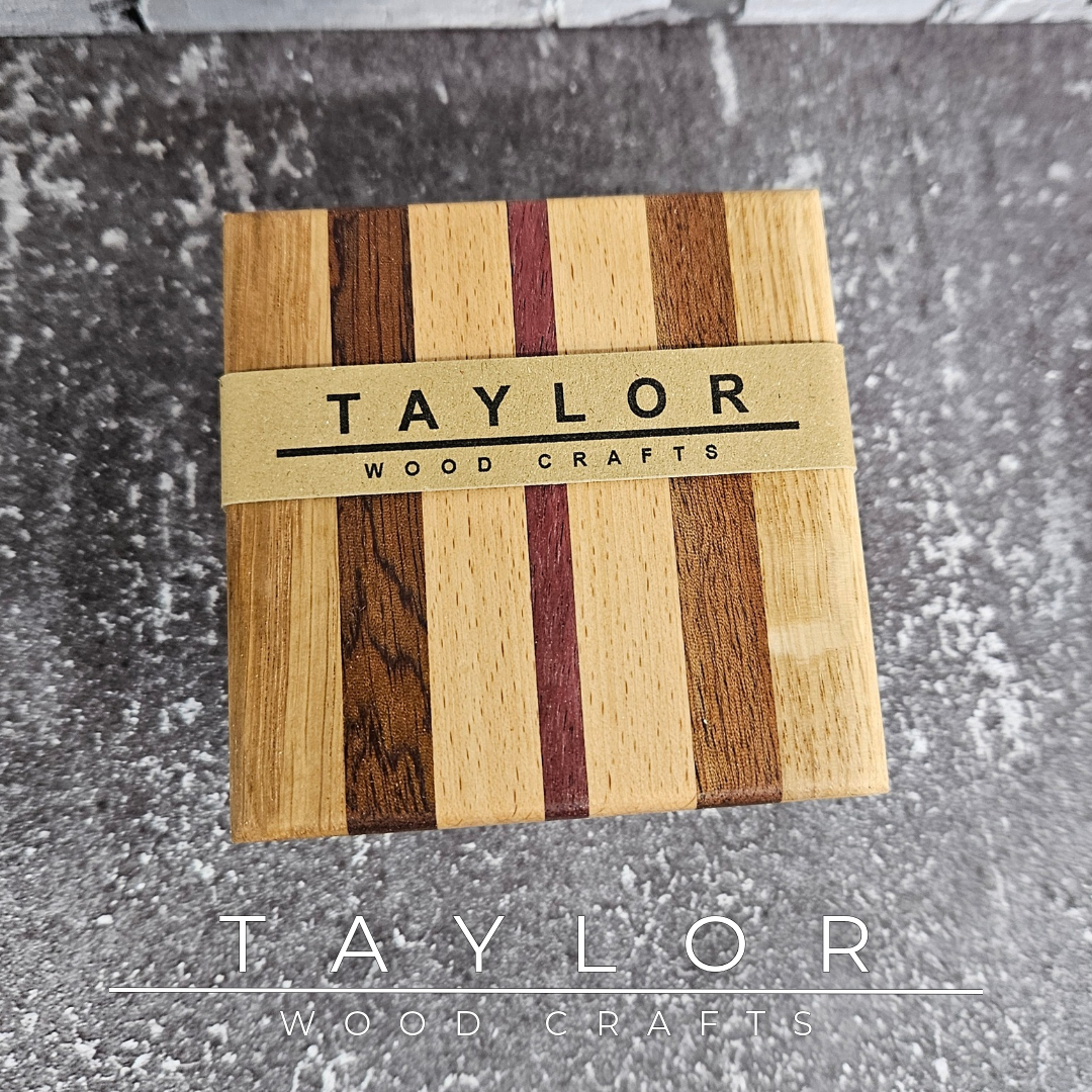 One-of-a-kind handmade wooden coaster set featuring a unique striped pattern created from contrasting hardwoods.