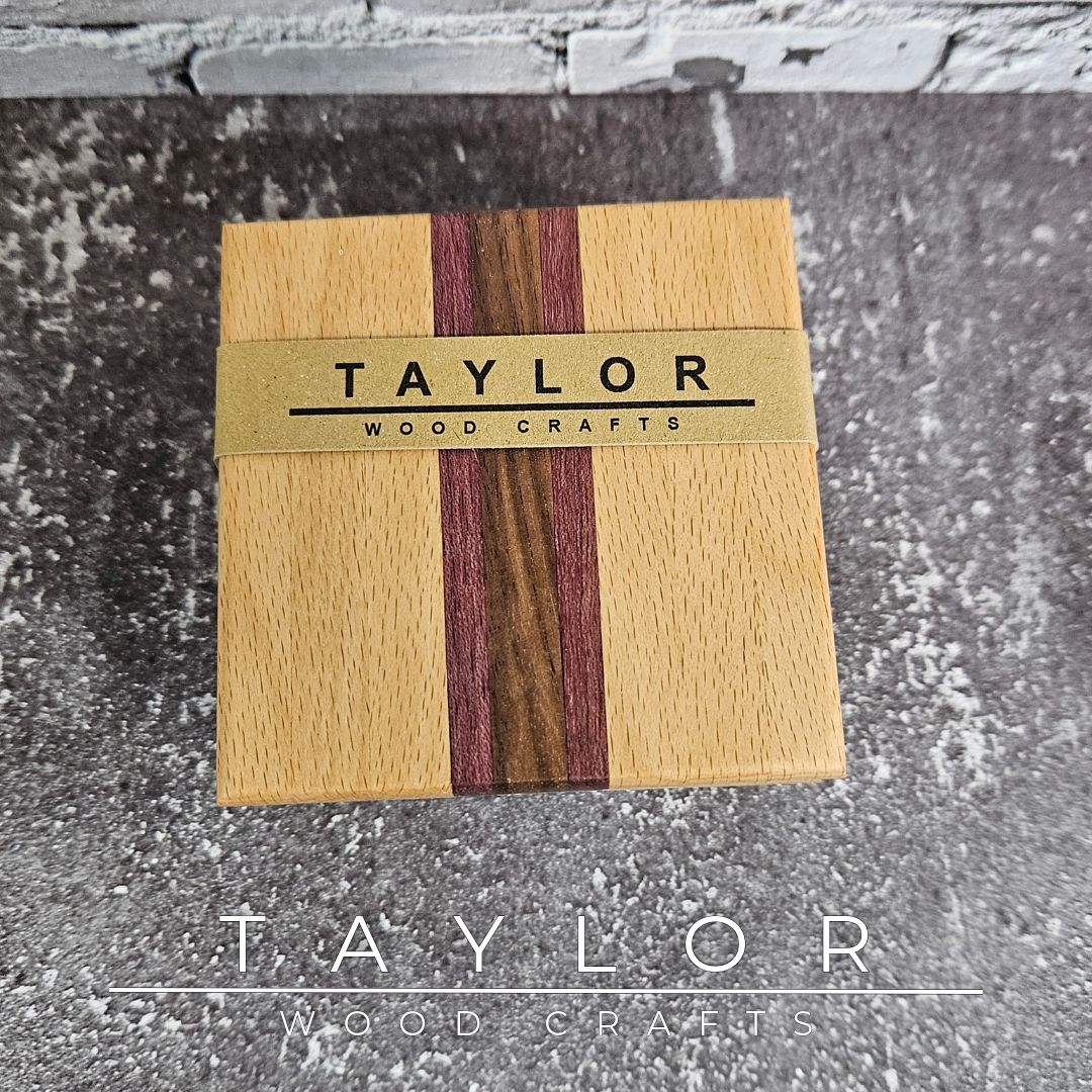 One-of-a-kind handmade wooden coaster set featuring a unique striped pattern created from contrasting hardwoods.